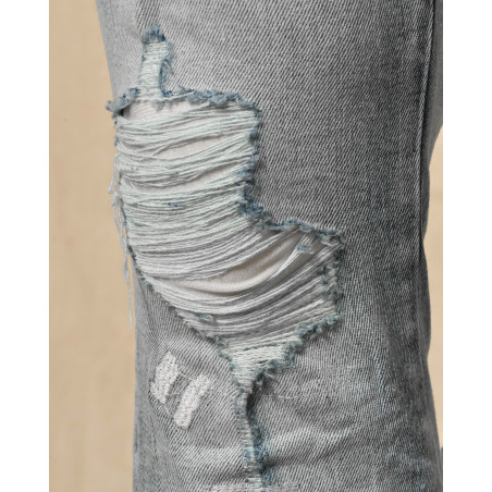 Jean délavé bleu à déchirures Ksubi