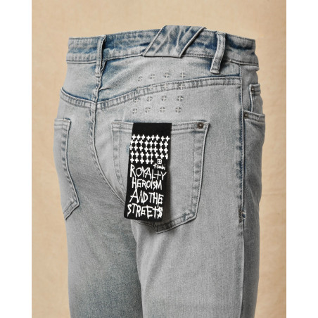 Jean délavé bleu à déchirures Ksubi