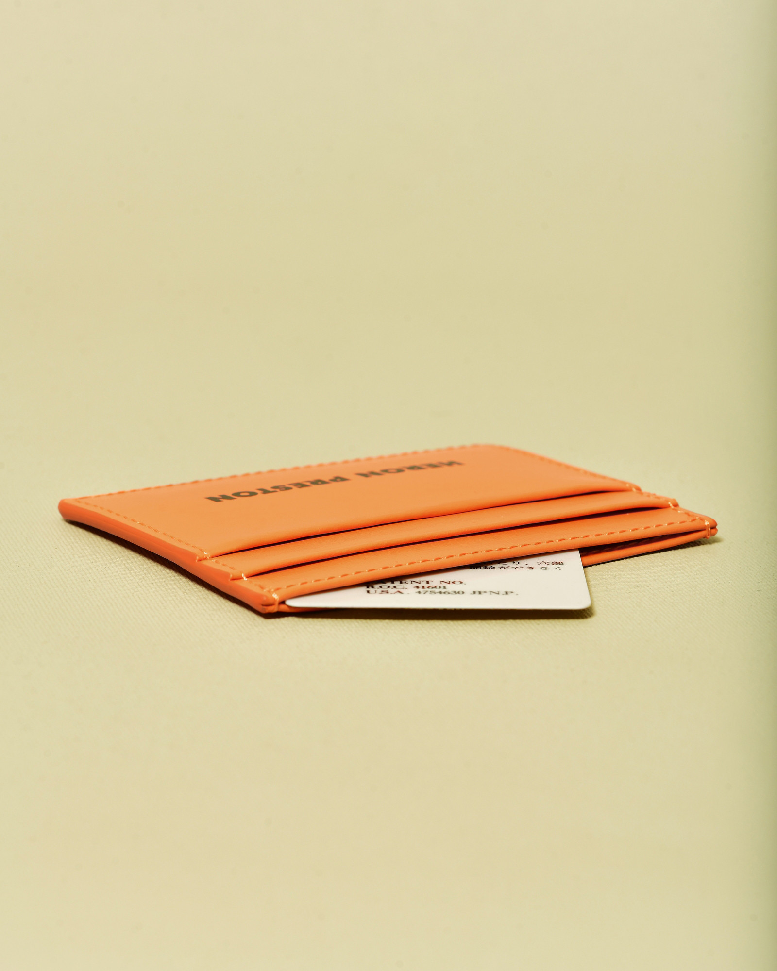 Portes cartes en cuir orange Heron Preston