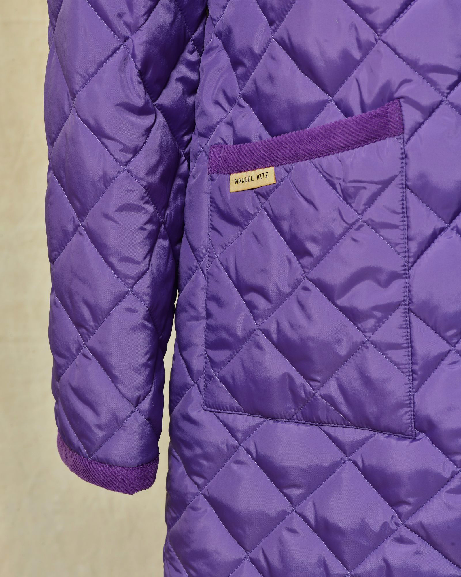 Blouson à capuche matelassé violet Manuel Ritz