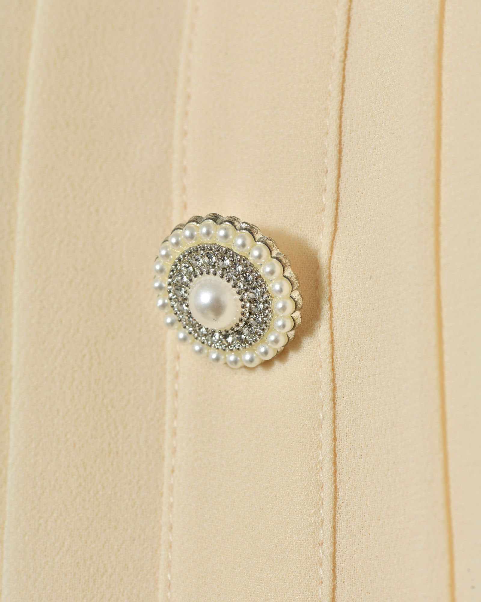 Top à volants et épaules dénudées beige Edward Achour